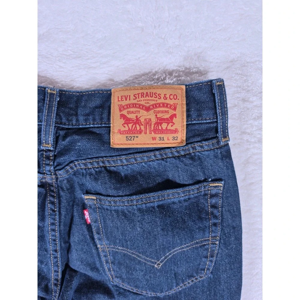 Levi's 527 Slim Bootcut Mens 31/32 Dark Blue Denim Raw Hem Jeans S110760
